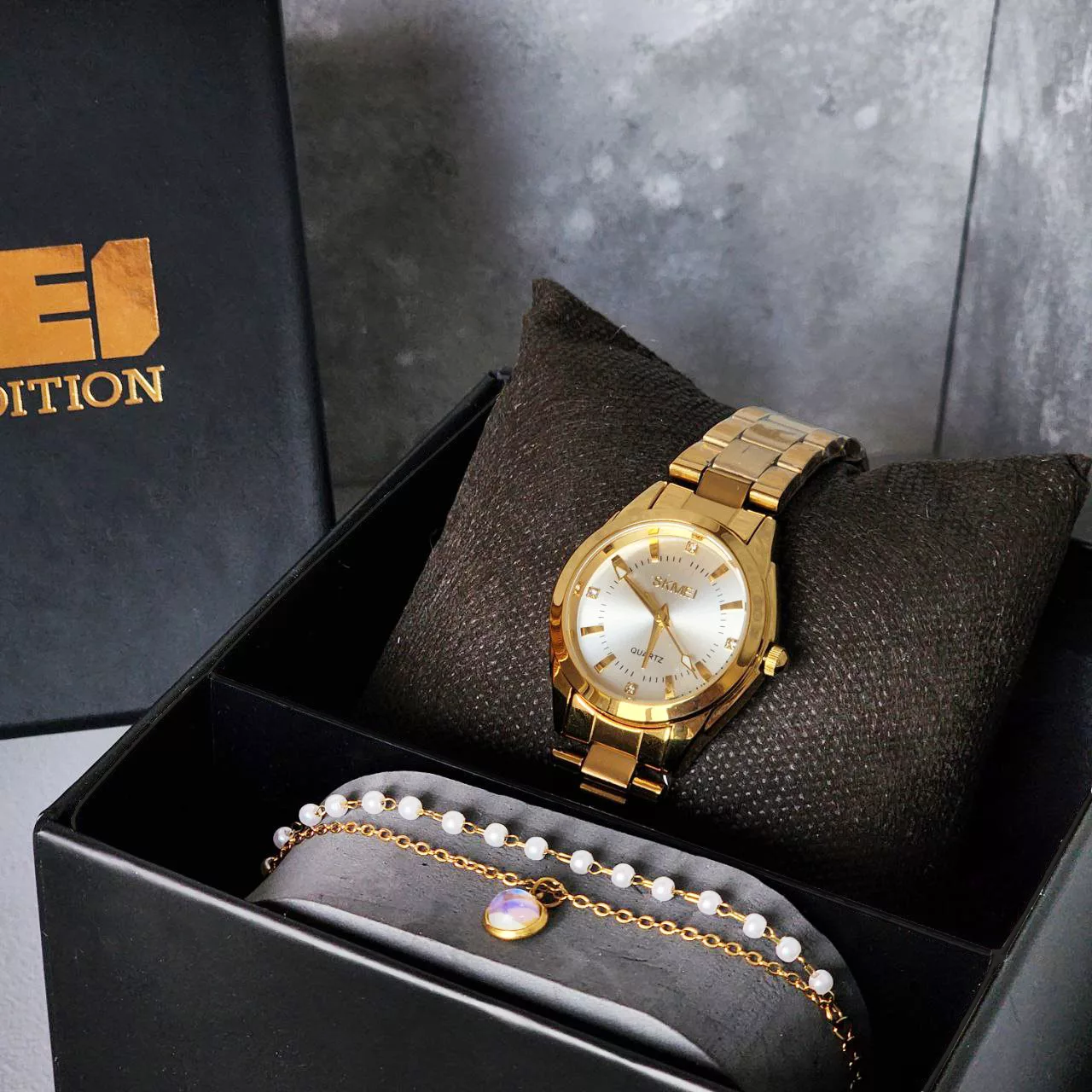 ساعت مچی عقربه ای زنانه اسکمی مدل 1620GD به همراه دستبند