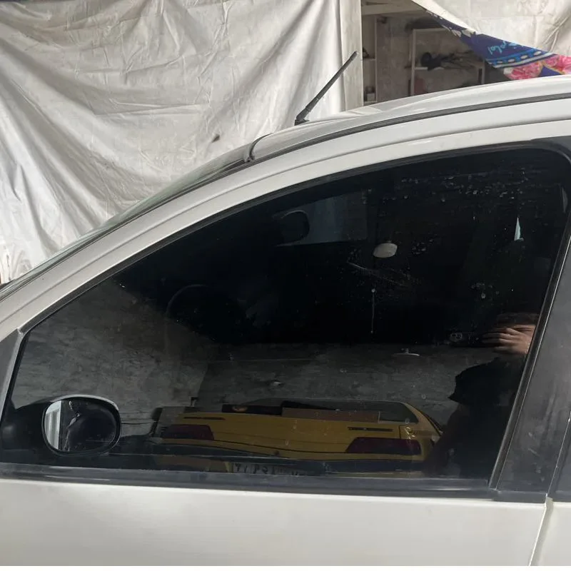 برچسب دودی شیشه خودرو هایلوکس کد Ddi15 مناسب برای پژو پارس مجموعه 7 عددی به همراه جاکلیدی