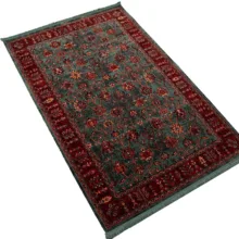 فرش ماشینی 700 شانه فرش ابریشمی کرامتیان زمینه قرمز حاشیه لاکی مدل بلوچی افشان 5108B