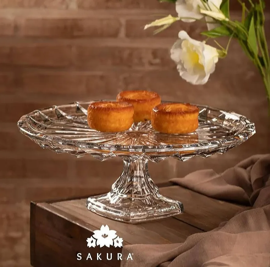 سرویس پذیرایی شیشهای ساکورا مدل مودنا شامل آجیلخوری، میوهخوری، شکلاتخوری و انارخوری با قابلیت شستوشو در ماشین ظرفشویی و دست و طراحی دایرهای همراه با جعبه