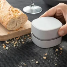 مینی جارو شارژی دستی مدل BTC1-011 با باتری لیتیوم‌یونی 1000 میلی‌آمپرساعت، موتور 3.7 وات و مخزن قابل جداسازی